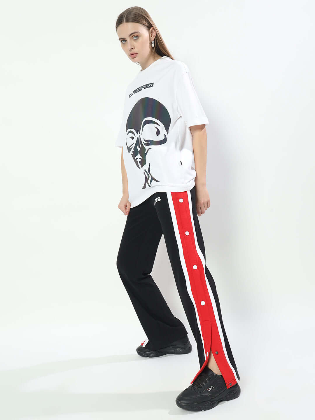 DUDS Magician jogger for women in black with side press studs, paired with a graphic white t-shirt, showcasing stylish casual attire.