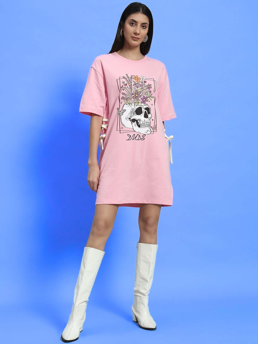 Women's baby pink dress with sugar skull design, premium cotton fabric, shown against a blue background. Made in India.