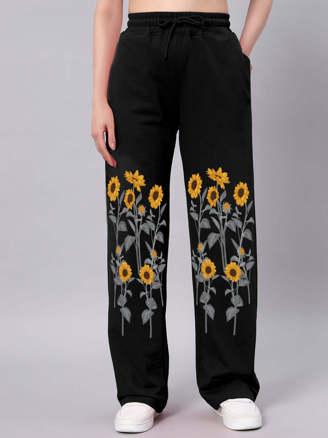 Black relaxed-fit joggers with sunflower design, made-to-order by DUDS, featuring customizable size options for personalized fit.