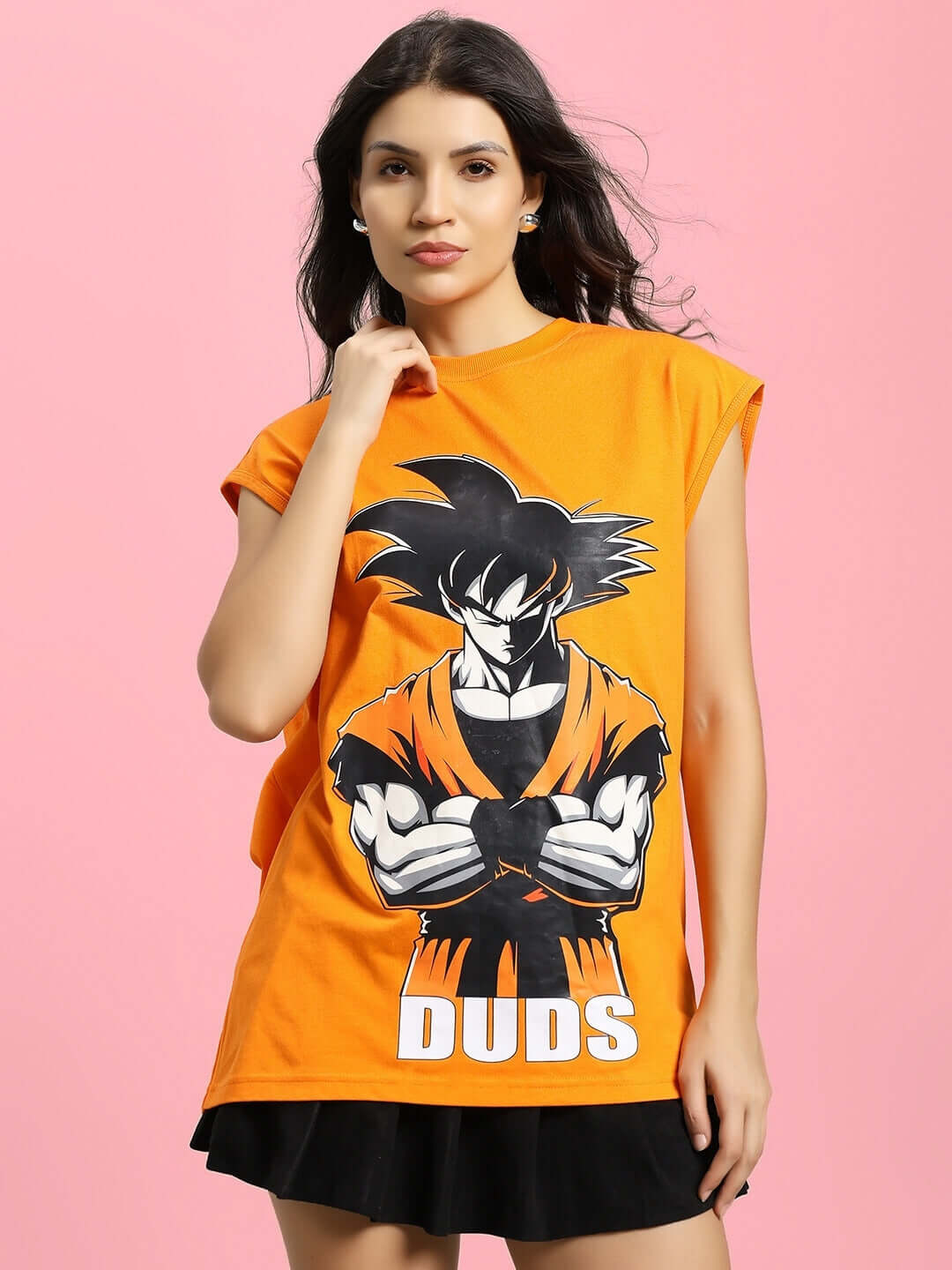 Woman wearing orange Super Saiyan gym t-shirt with DUDS branding, showcasing a bold anime-inspired print on the front.