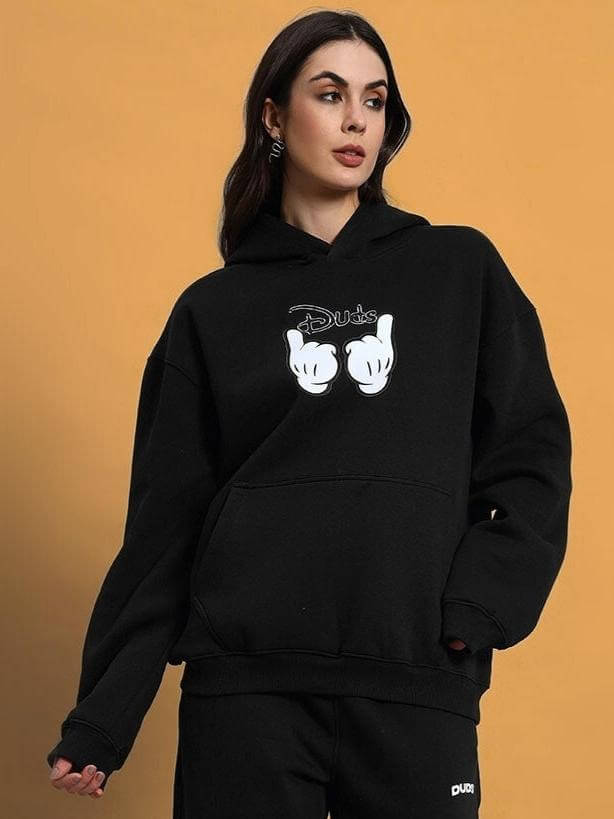 Model wearing WOMEN SUPREME FLEECE HOODIE BLACK with unique design by DUDS, available for custom fit.