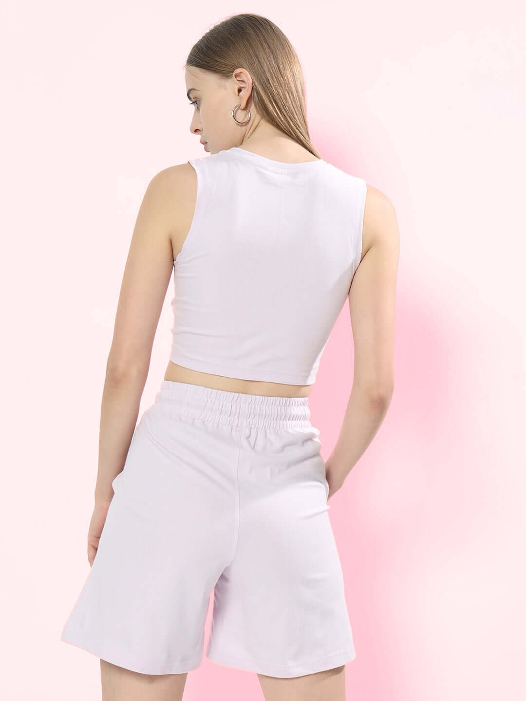 Back view of woman wearing lilac co-ord set with printed top and shorts, showcasing premium cotton terry fabric.