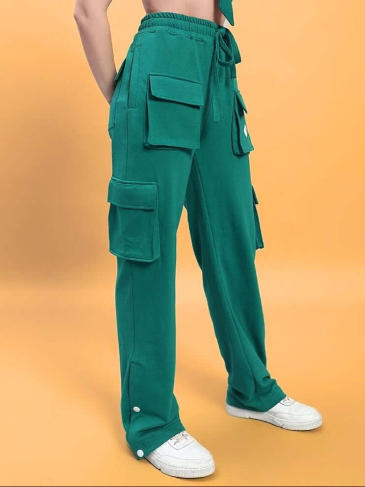 Women's teal green cargo pants with 8 pockets by DUDS, customizable fit option available. Made to order by experienced tailors.
