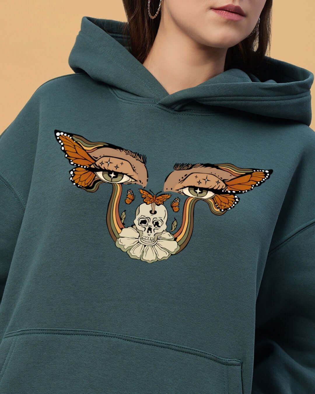 WOMEN'S EYES ON RISE FLEECE CO-ORD TEAL GREEN hoodie with artistic eye and skull design.