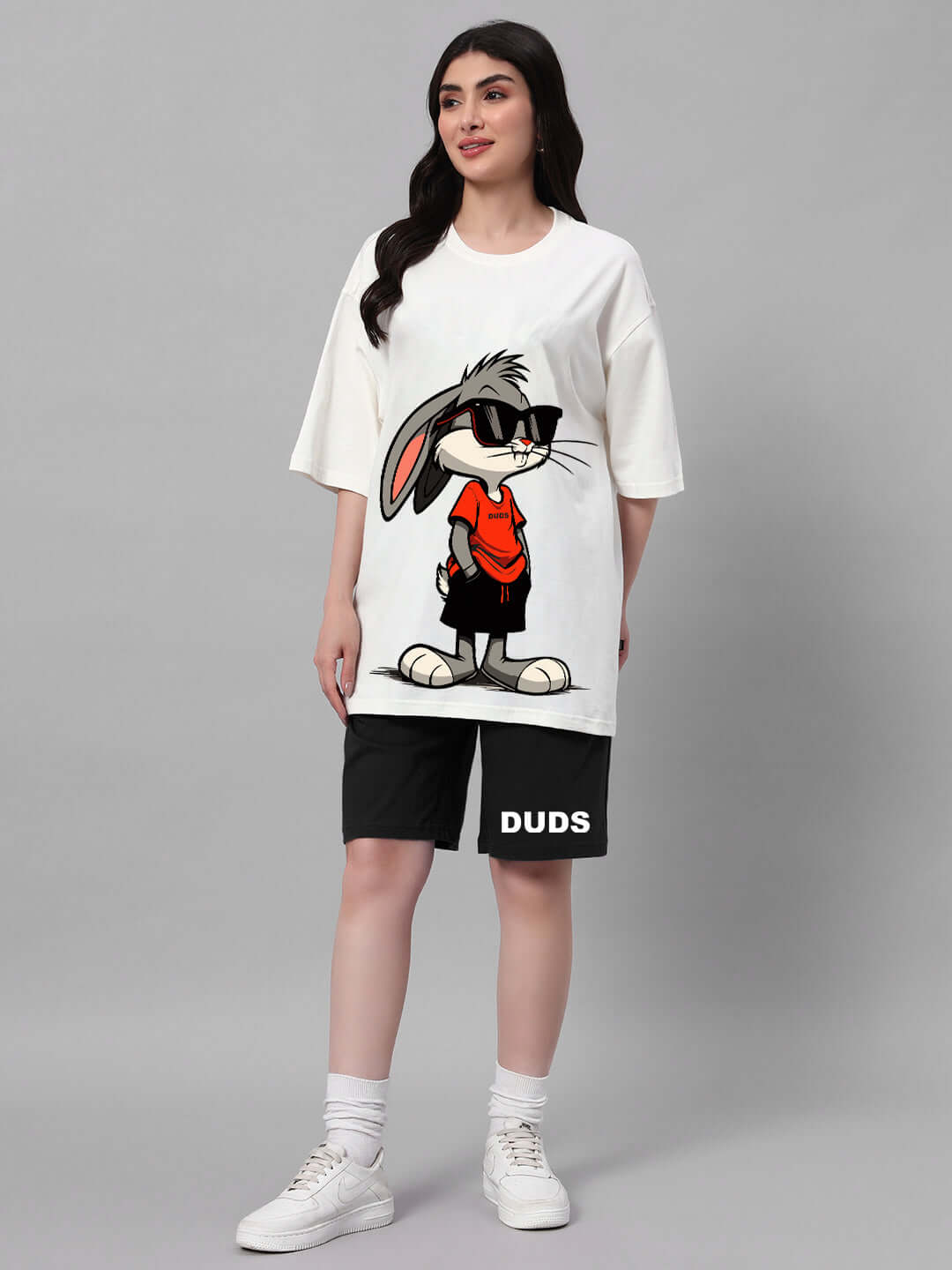 Woman wearing off-white black Think Big Bunny Toons co-ord set, featuring a cartoon bunny print, made from cotton French terry lycra blend.