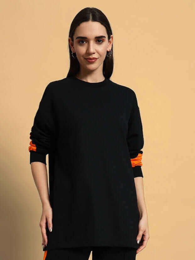 Model wearing Women's Titan Oversized Sweatshirt in black, featuring premium cotton blend fabric, ideal for comfort and style.