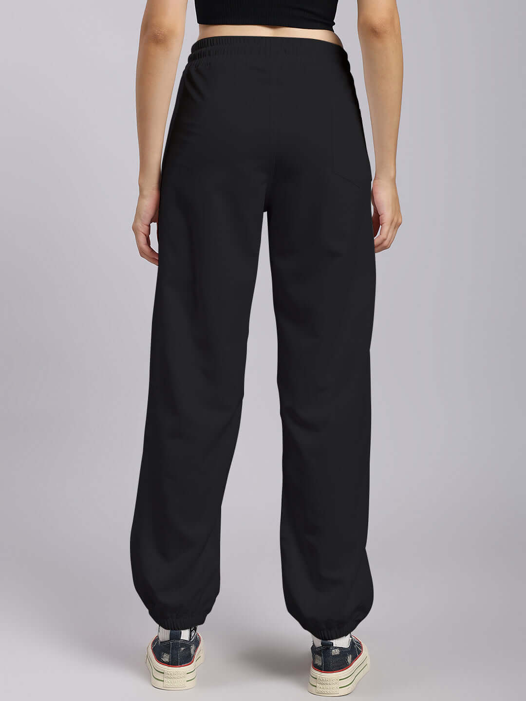 Black women's Tokyo relaxed fit joggers with custom fit option, designed by DUDS, shown from the back.