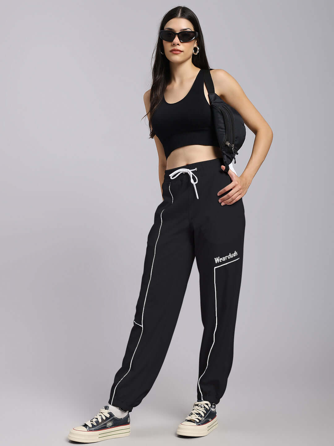 Model wearing Women's Tokyo Relaxed Fit Joggers in Black with custom fit option by DUDS, perfect for casual and comfortable style.