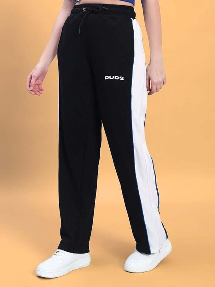 Alt Tag: Women's Triumph Multi Zipper Joggers in Black with Blue Accents by DUDS, featuring a custom fit option for perfect tailoring.