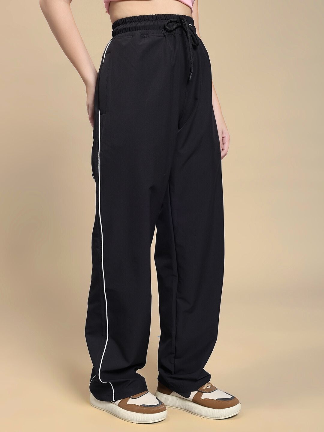 WOMEN TURBO TRACK RELAXED-FIT JOGGERS BLACK on display with side stripe detailing and comfortable fit.