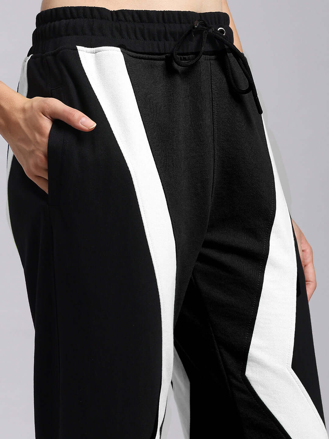 Women's ultra colorblock relaxed-fit joggers in black and white, featuring a comfortable drawstring waistband and stylish side stripes.