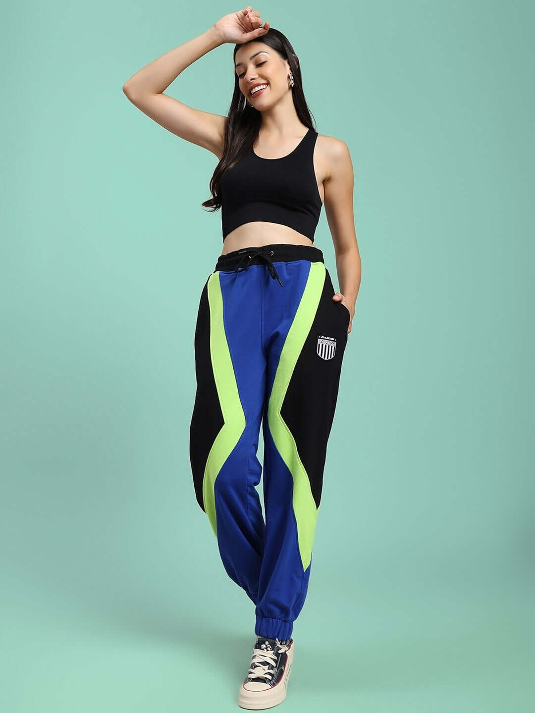 Women's ultra colorblock relaxed-fit joggers in blue-black with neon accents, perfect for casual wear. Available in custom fit options.