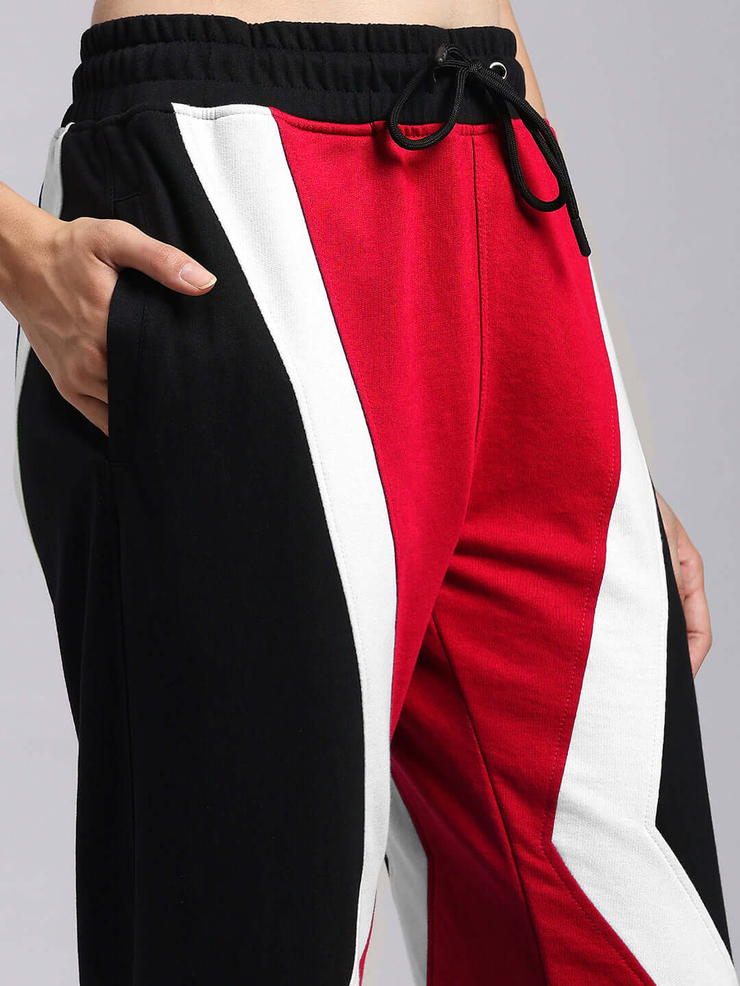 Close-up of Womens Ultra Colorblock Relaxed-Fit Joggers Red-Black showing the bold design and comfortable fabric.