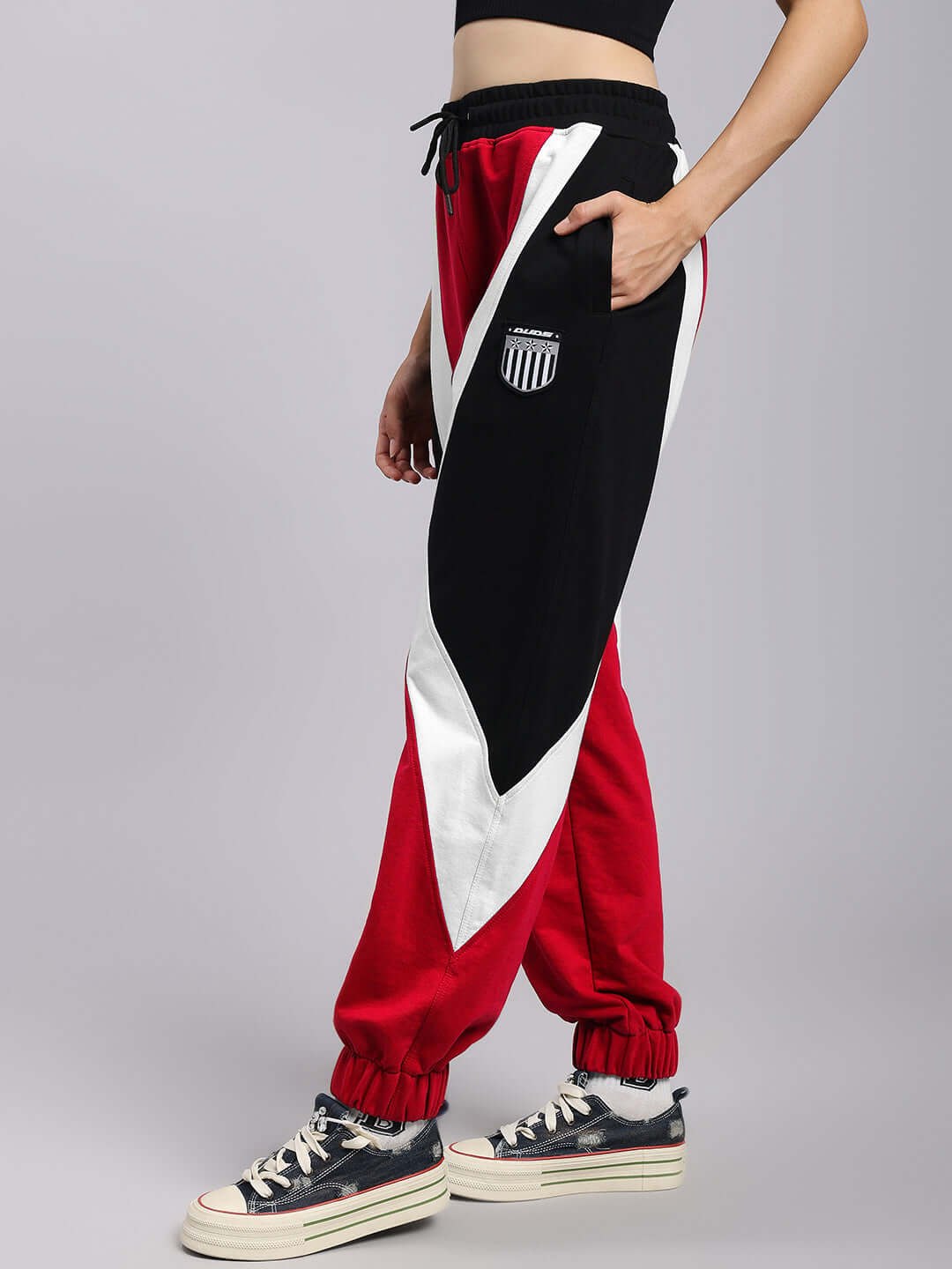WOMENS ULTRA COLORBLOCK RELAXED-FIT JOGGERS RED-BLACK shown on a model, highlighting the stylish red and black design.