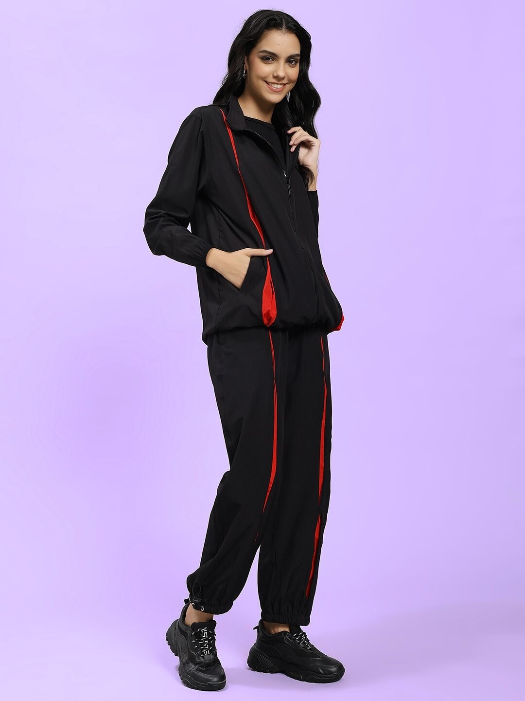 Model wearing WOMEN UNISON RELAXED FIT CO-ORD SET BLACK RED showcasing stylish comfort.