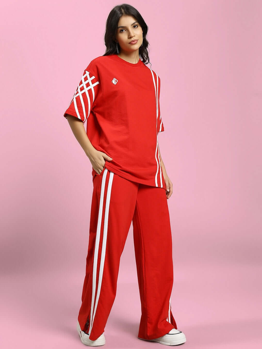 Woman wearing WOMENS UNITED STRIPE CO-ORD SET RED, featuring bold red color with stripe detailing.