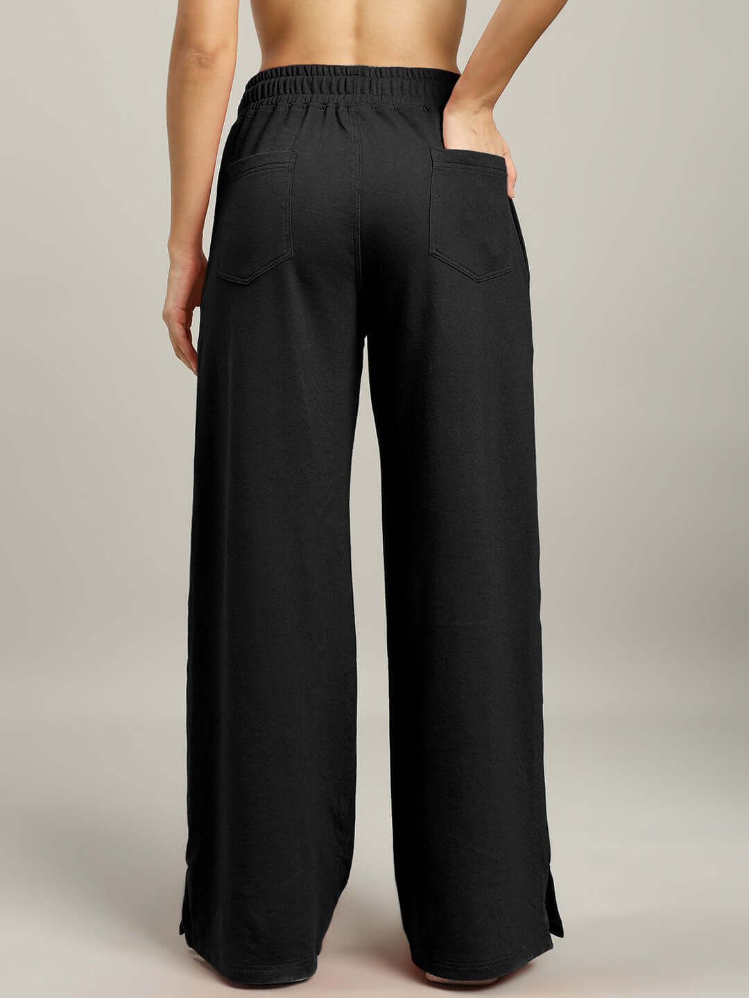 Back view of black women's United Stripe joggers featuring wide leg design, made to order with customizable size options.
