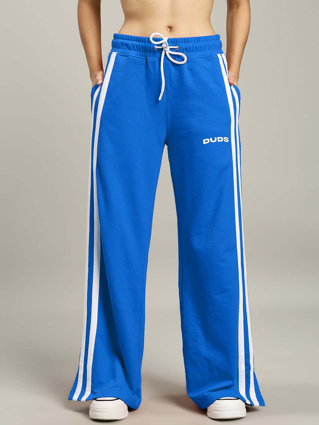 Blue women's stripe joggers by DUDS, featuring white side stripes and custom fit option for prepaid orders.