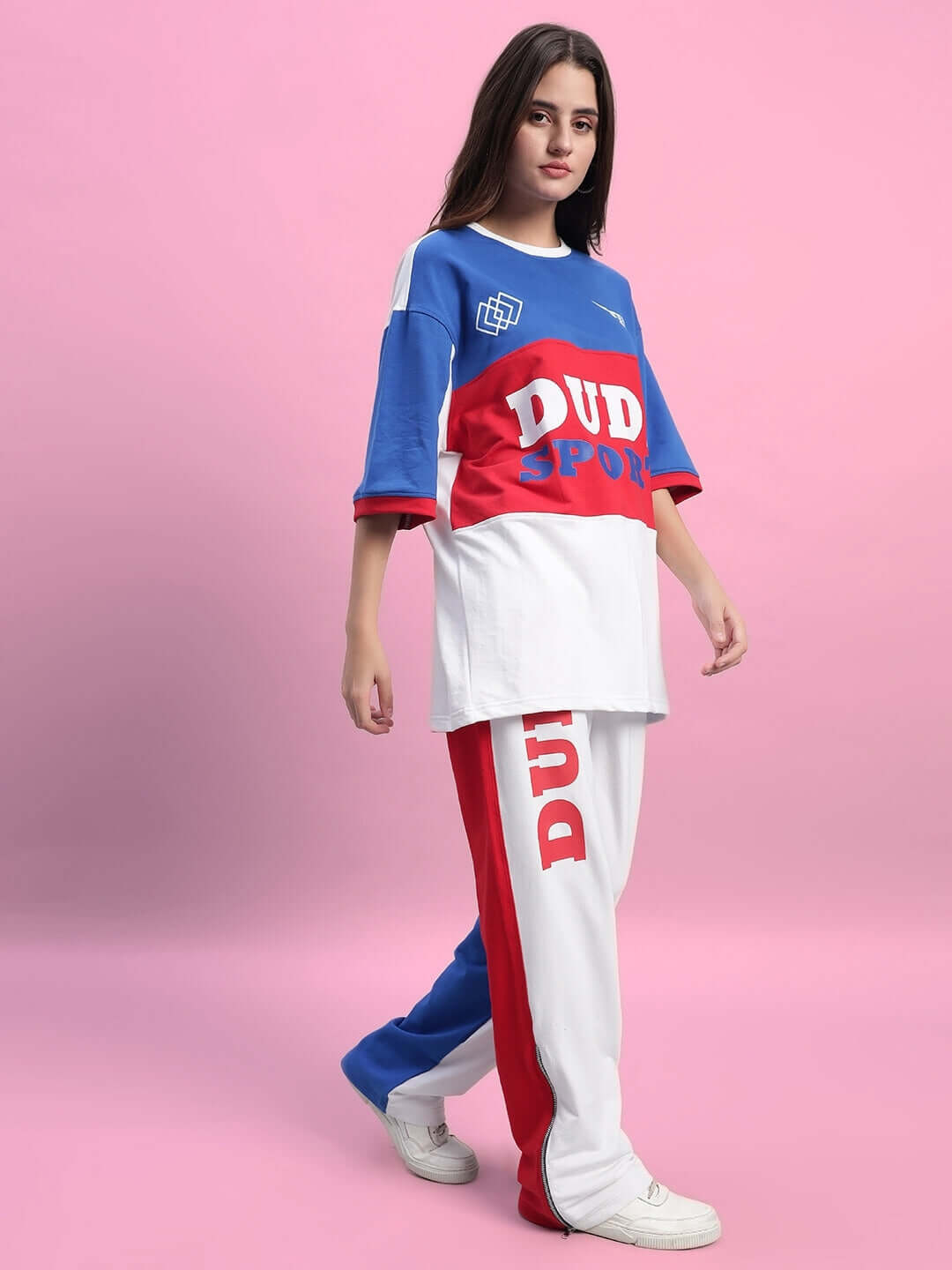 Woman wearing WOMEN'S URBAN DRIFT CO-ORD SET MULTI in bold colors, stylish oversized top and pants.