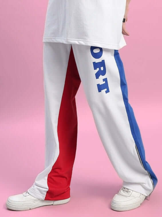 Women’s urban drift relaxed fit joggers in multicolor with sporty color-block design, shown with casual sneakers.