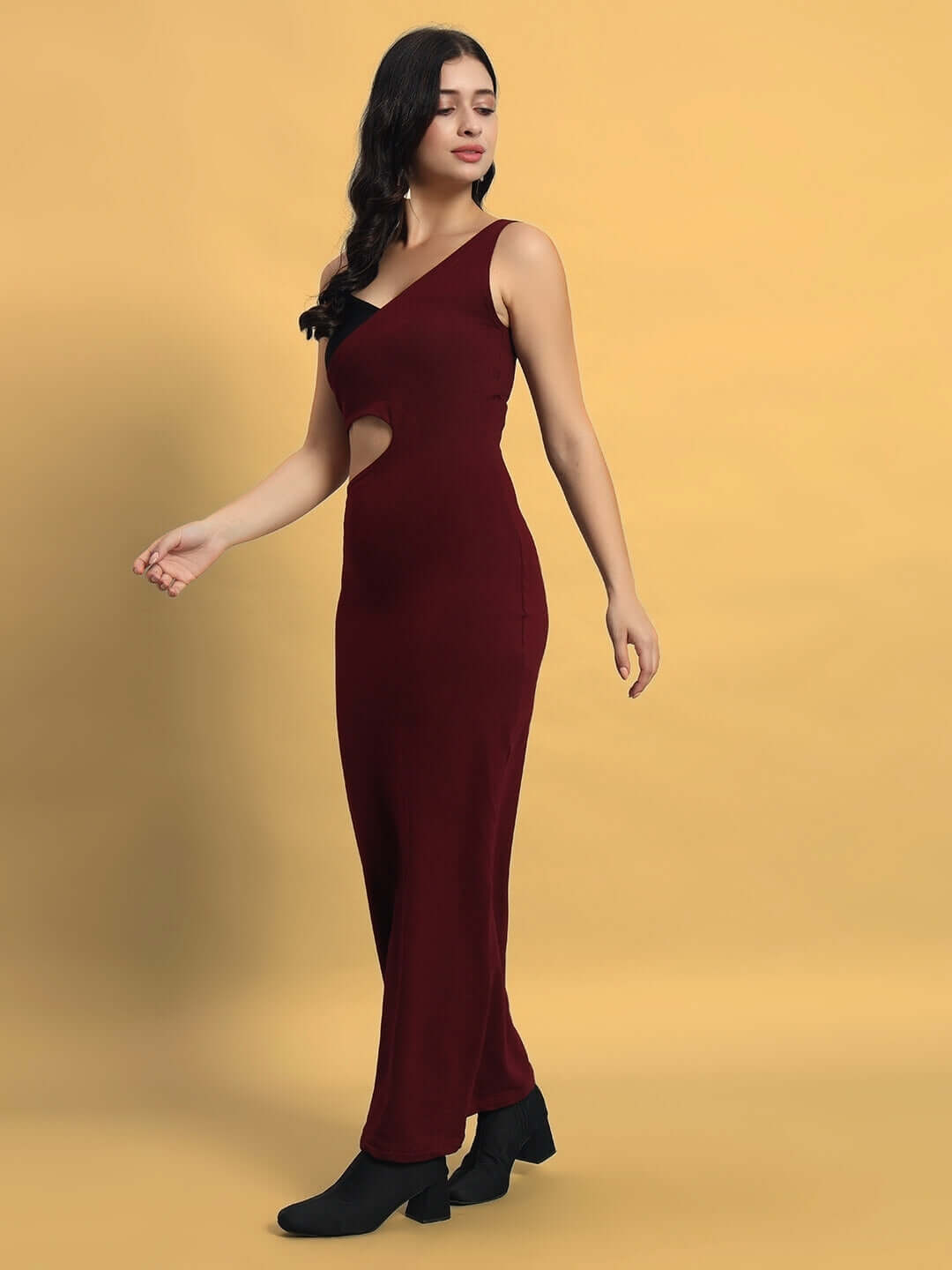 Model wearing Women's Valencia Lycra Dress in maroon, featuring a sleek design with a four-way stretch for flexible movement.