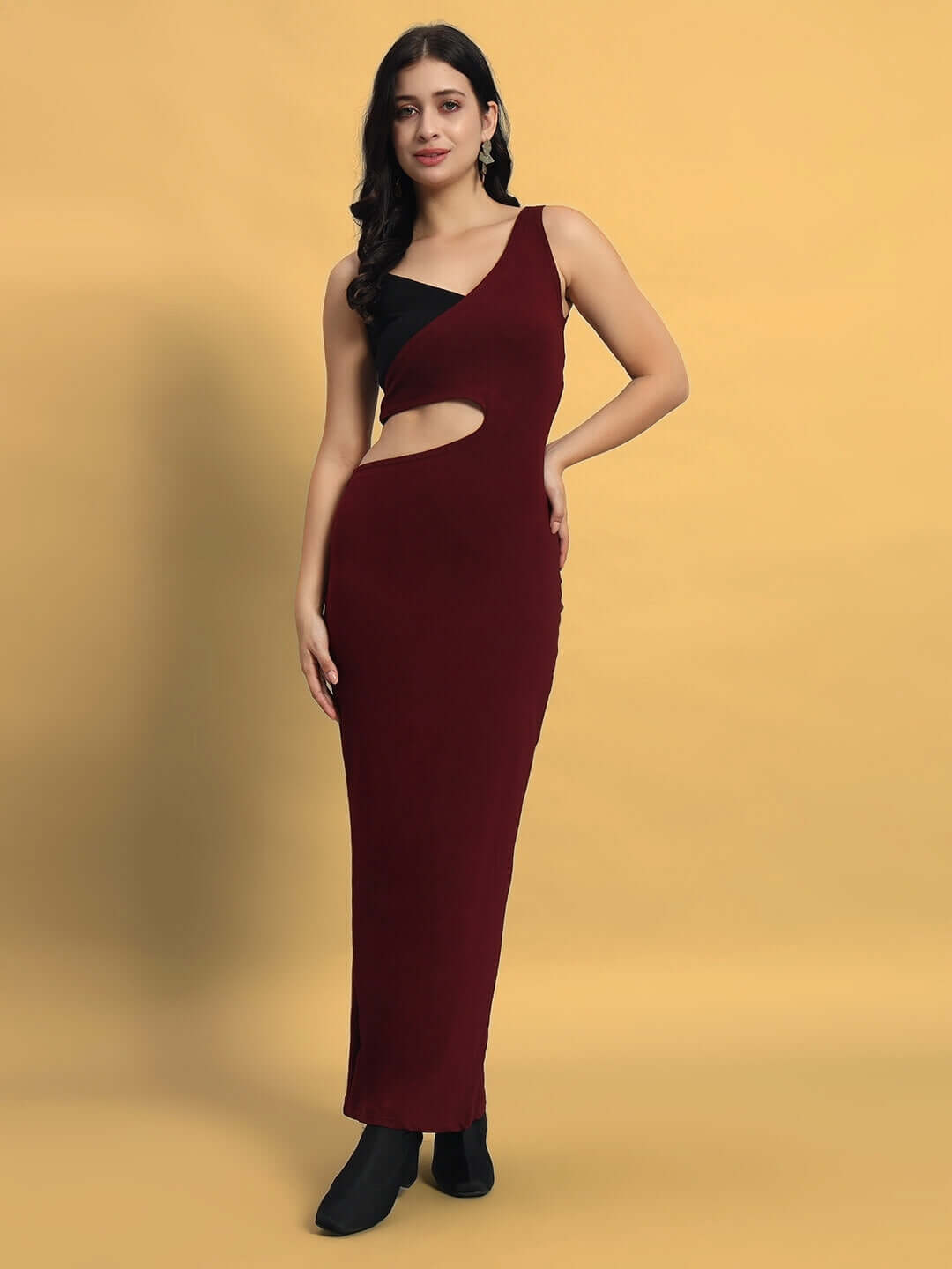 Woman wearing Women's Valencia Lycra Dress in maroon, made of 90% polyester and 10% spandex, featuring a sleek, elegant design.