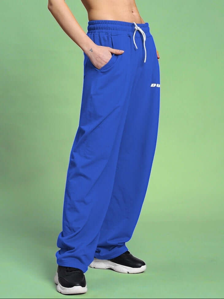 Blue women's relaxed-fit joggers with drawstring waistband, shown on model, custom fit option available.