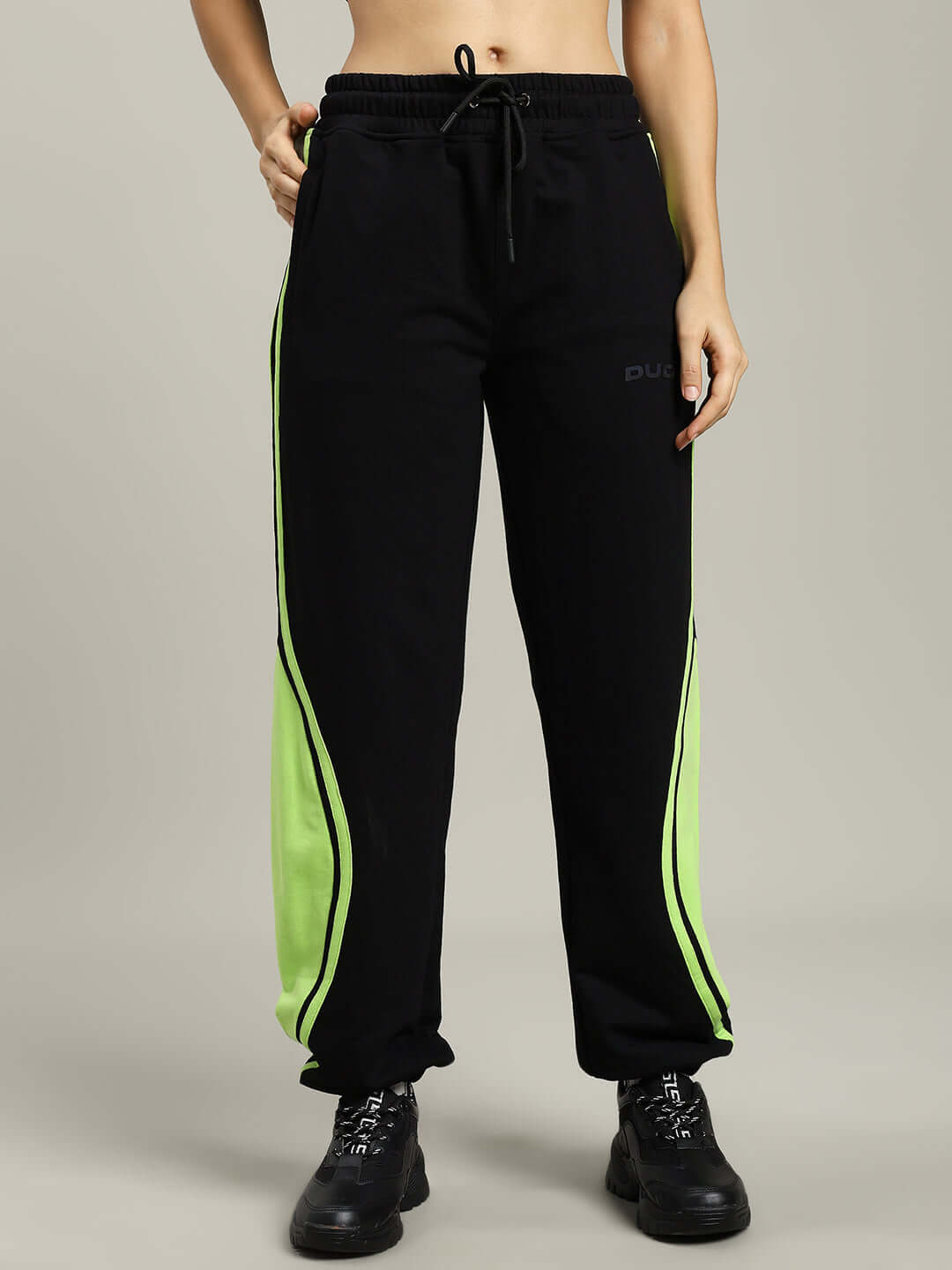 Women's black and neon joggers with customizable fit from DUDS, made-to-order with experienced craftsmanship.