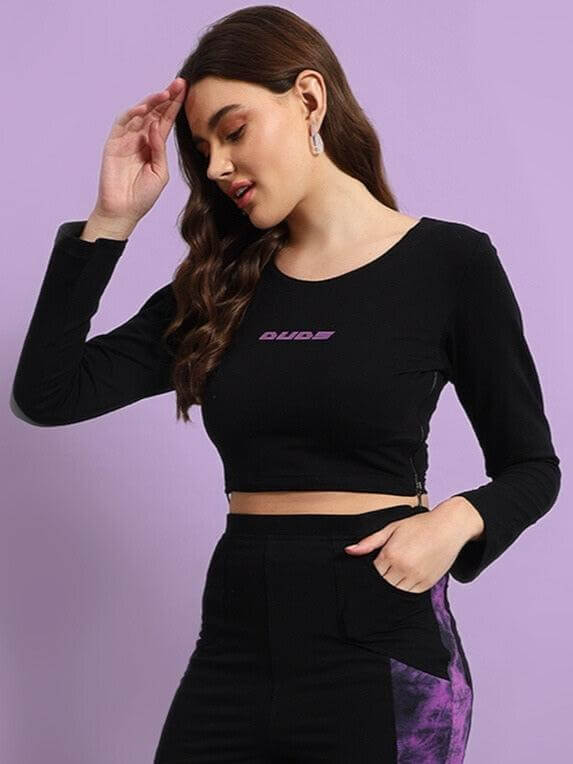Woman wearing Women's Viola Co-ord Set in black and purple with relaxed fit joggers and crop top, styled with elegance.