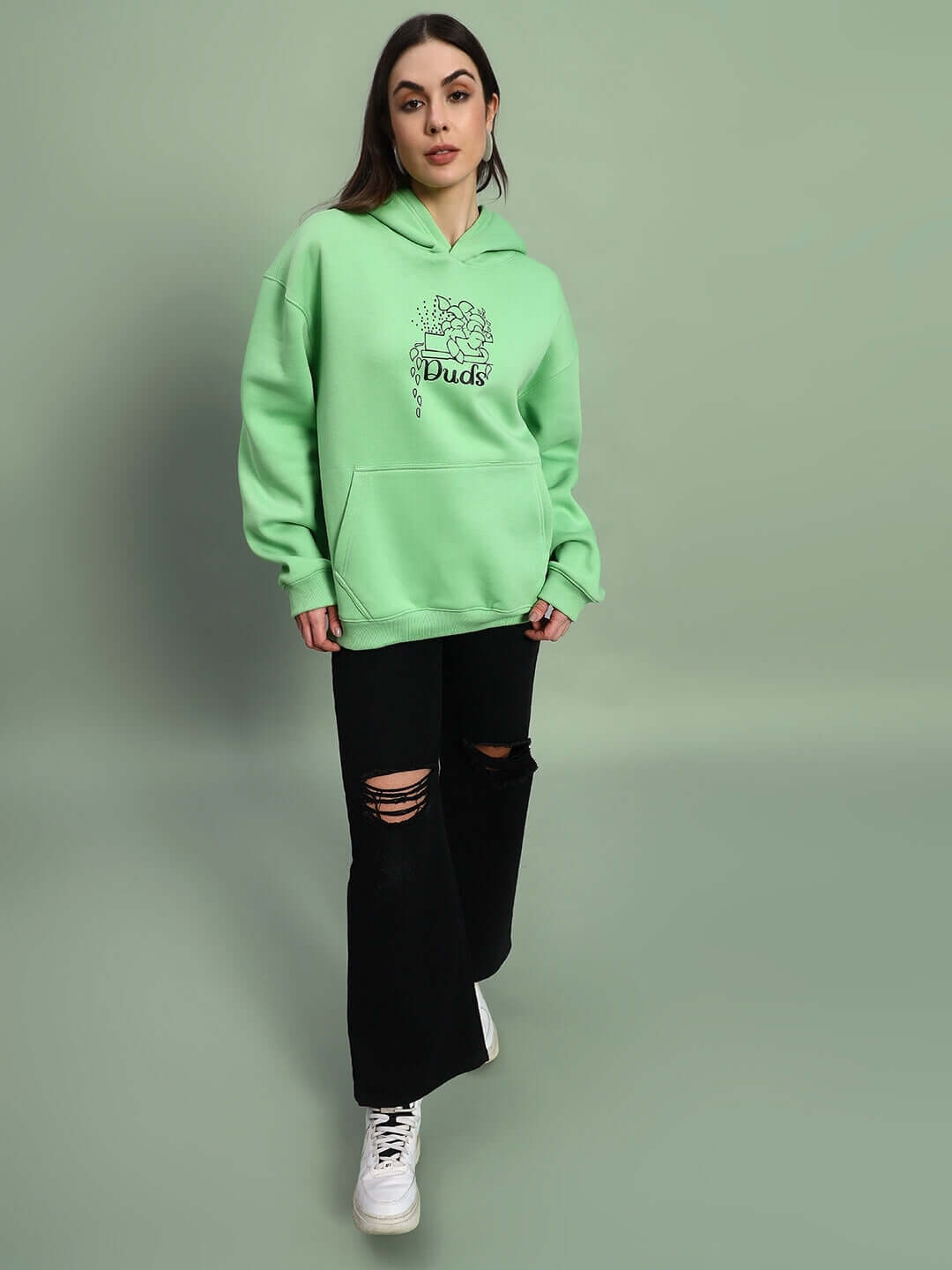 Model wearing WOMEN VOODO FLEECE OVERSIZED HOODIE GREEN, streetwear style, cozy and vibrant fleece hoodie.