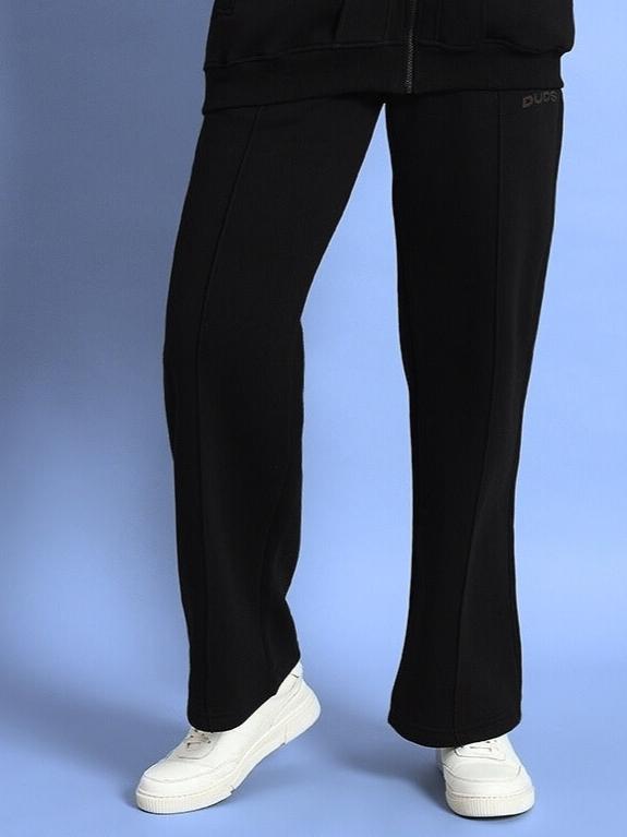 WOMEN WD ADMIRE FLEECE CARGO PANT BLACK displayed on a model, showcasing its sleek design and streetwear style.