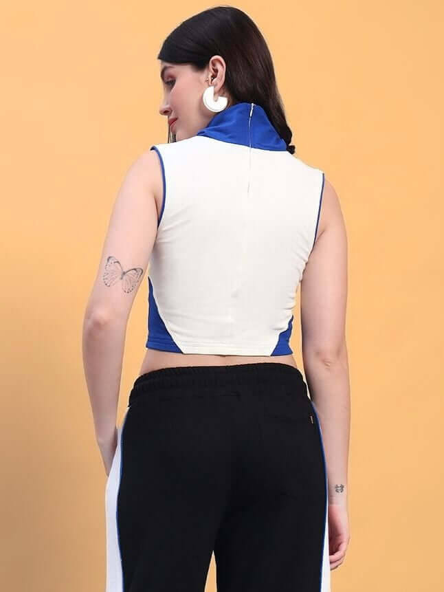 Rear view of a woman wearing a white and blue MYSKY crop-top, showcasing unique sleeveless design and tattoo on the arm.