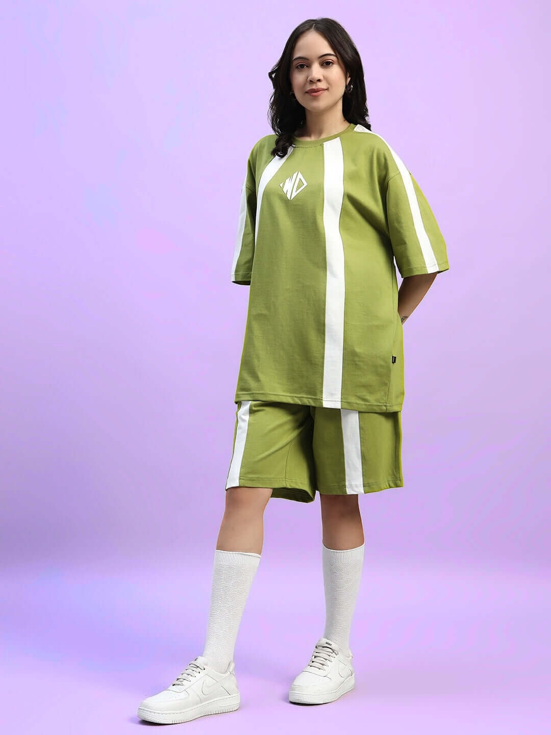 Woman wearing WOMEN'S WIDELINE SUMMER CO-ORD SET OLIVE GREEN, featuring premium heavy gauge fabric with cotton and elastane blend.