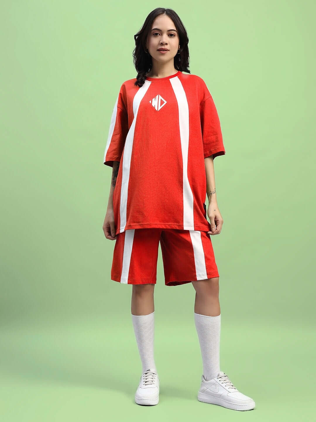 Woman wearing Womens Wideline Summer Co-Ord Set Red in lightweight premium cotton, featuring relaxed fit top, perfect for summer style.