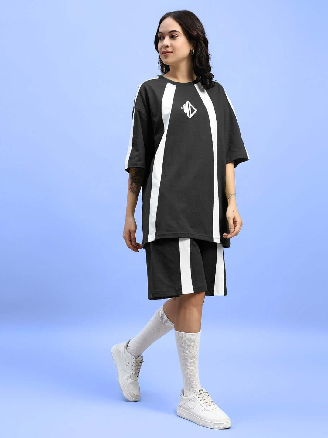 Woman wearing Womens Wideline Summer Co-Ord Set Black, relaxed fit, lightweight premium cotton, perfect for warm-weather style and comfort.