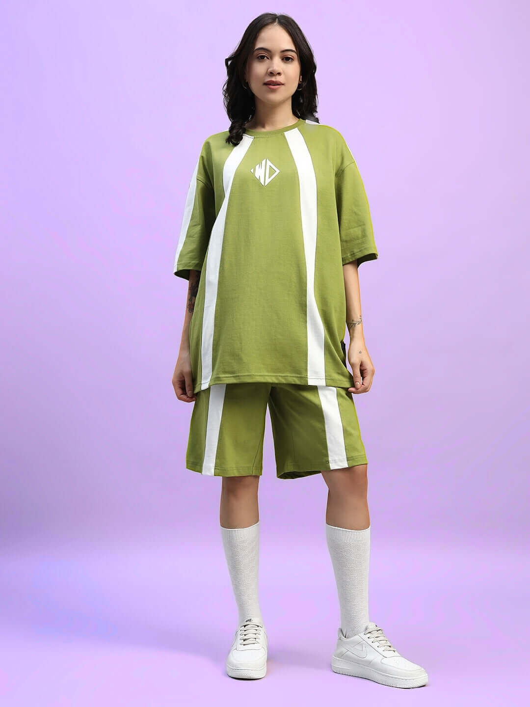 Model wearing WOMEN'S WIDELINE SUMMER CO-ORD SET OLIVE GREEN, showcasing style and comfort in breathable cotton fabric.