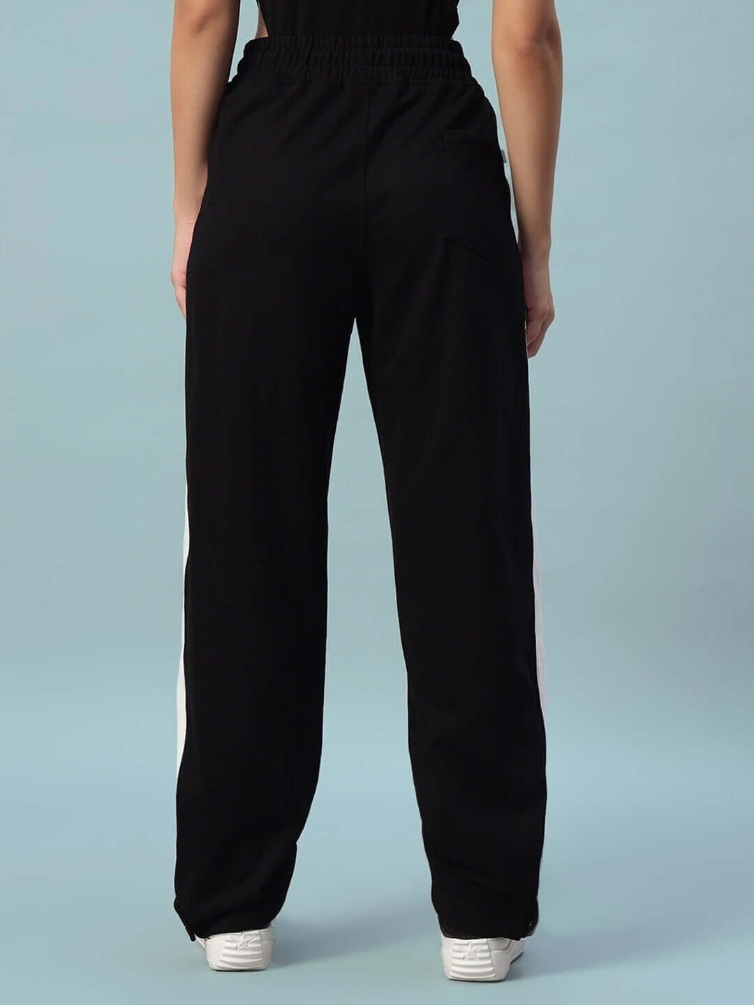 Back view of Women's Wonder Slit Zipper Joggers in black with white stripes, showcasing custom fit options by DUDS