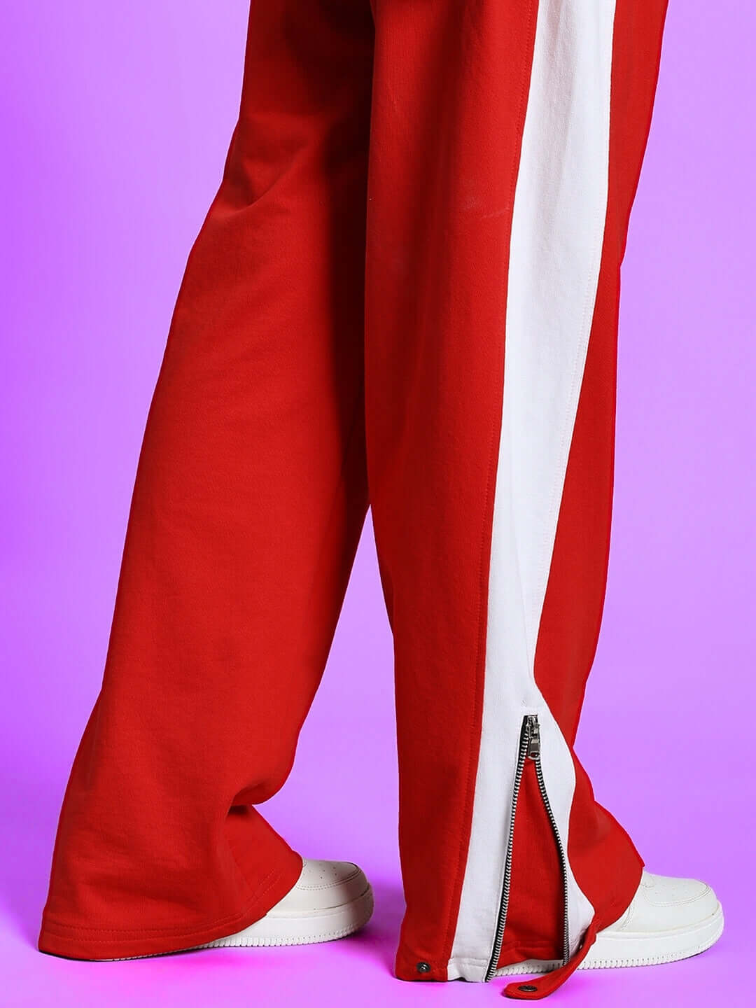 Women's Wonder Slit Zipper Joggers in Red-White with custom fit option, stylish design featuring side zippers, shown against purple backdrop