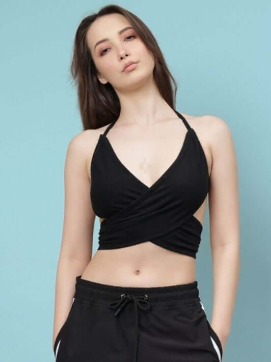 Model wearing Women's Xavier Criss Cross Crop-Top in black, made from premium heavy gauge cotton fabric. Stylish and comfortable fashion.