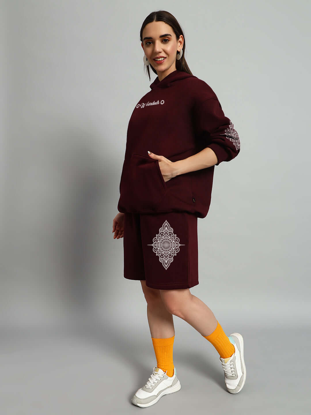 Model wearing WOMEN'S YANTRA FLEECE CO-ORD SET WINE in cozy fleece with bold wine color, showcasing comfort and streetwear style.