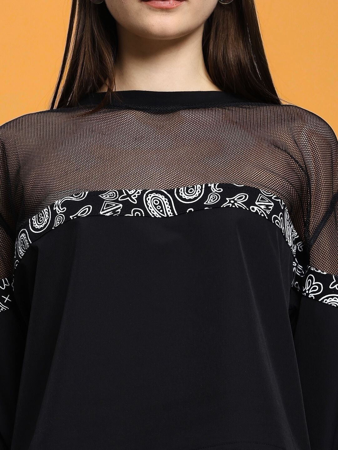 Close-up of Women's Yesmin Relaxed Fit Top Black with mesh and paisley details, showcasing elegant style and comfort.