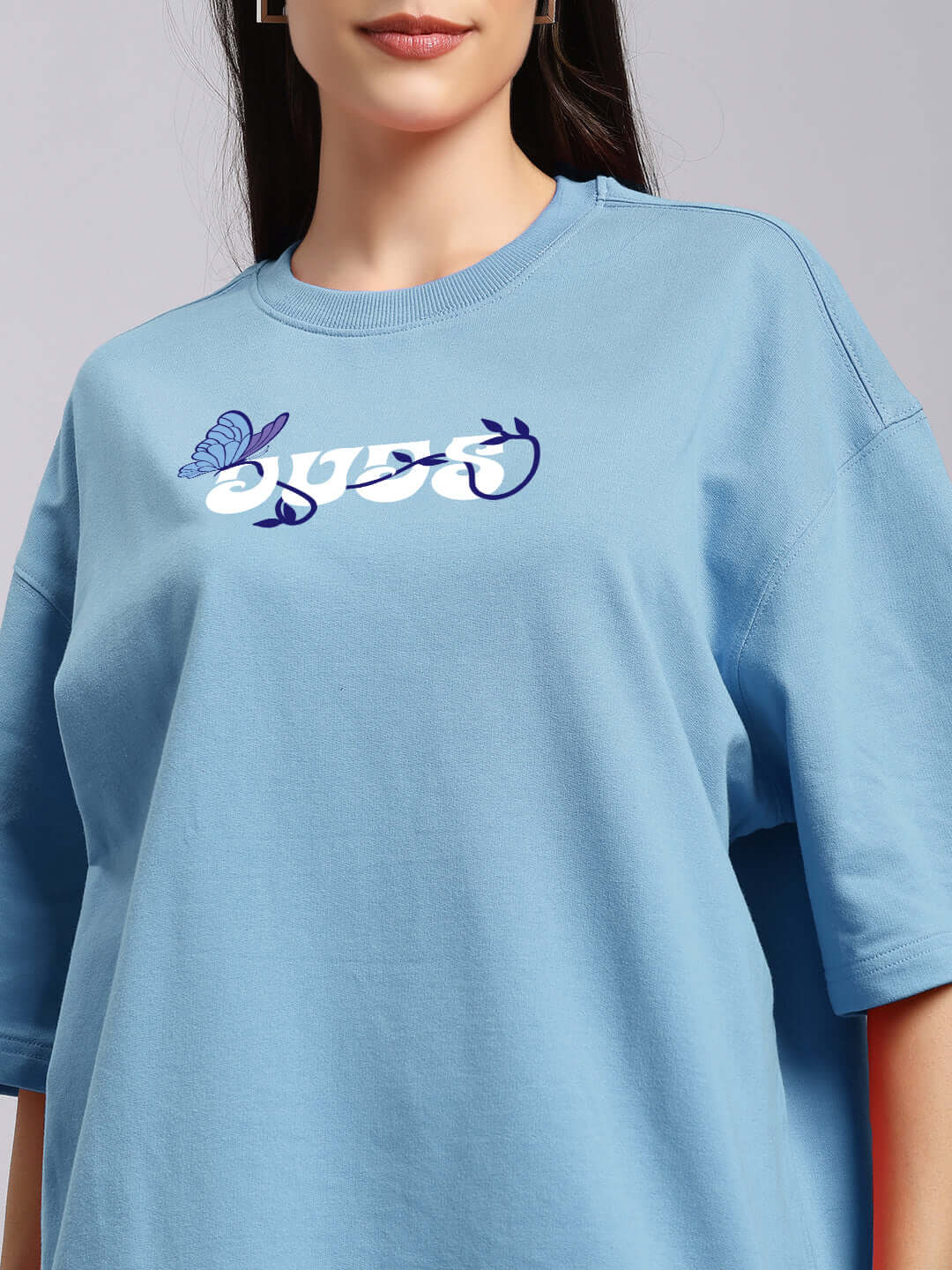 Sky blue women's printed T-shirt with butterfly design, made from premium cotton French terry for comfort, featuring a short sleeve style.