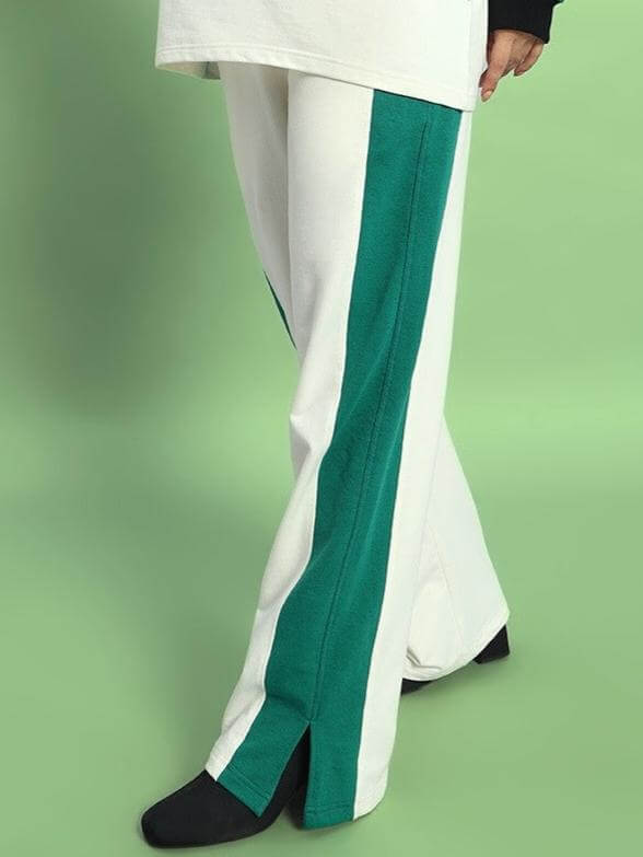 Women's Zingy Jogger in off-white and teal with unique design, crafted by skilled tailors from DUDS. Custom fit options available.