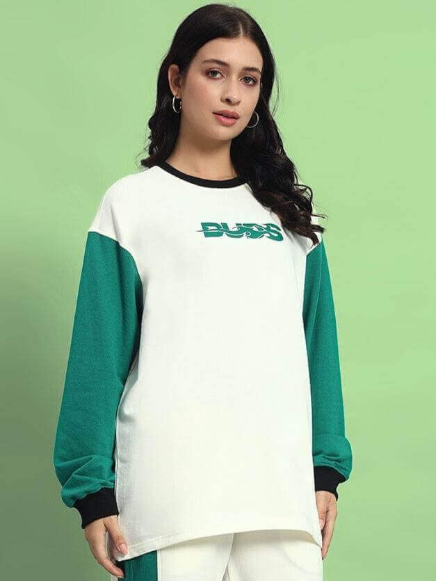 Model wearing Women's Zingy Oversized Sweatshirt in off white-teal, featuring premium cotton fabric and stylish design.
