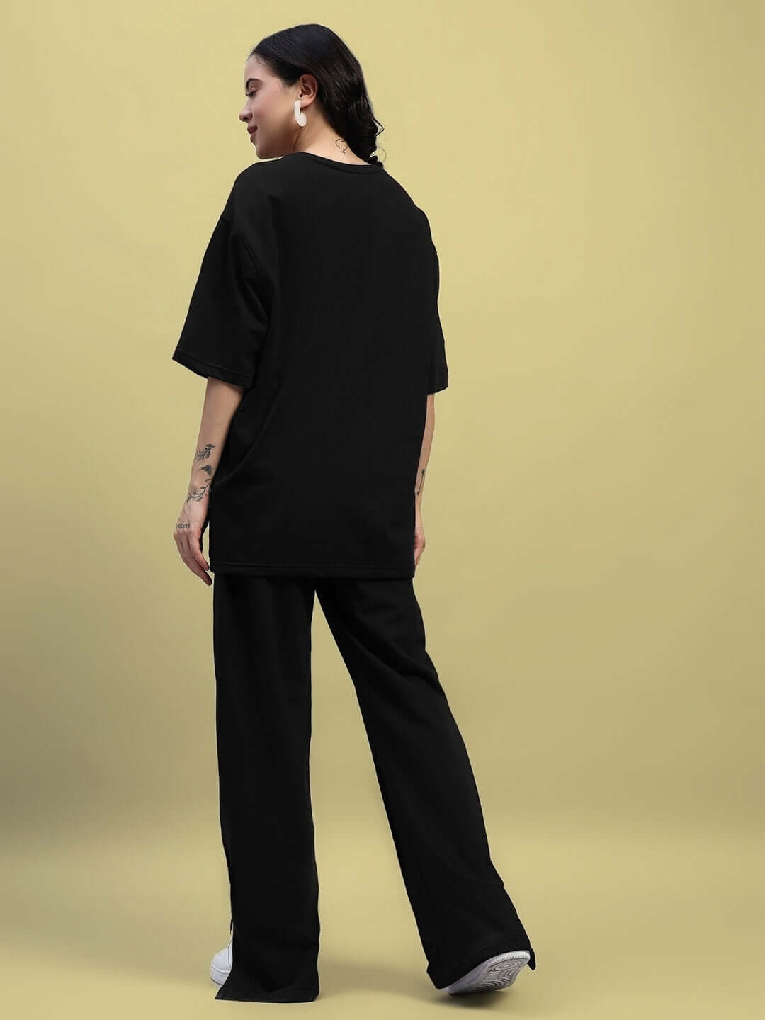 Woman wearing WOMEN'S ZION Relaxed Fit Co-Ord Set in black, featuring a comfortable T-shirt and joggers with an elasticated waistband.