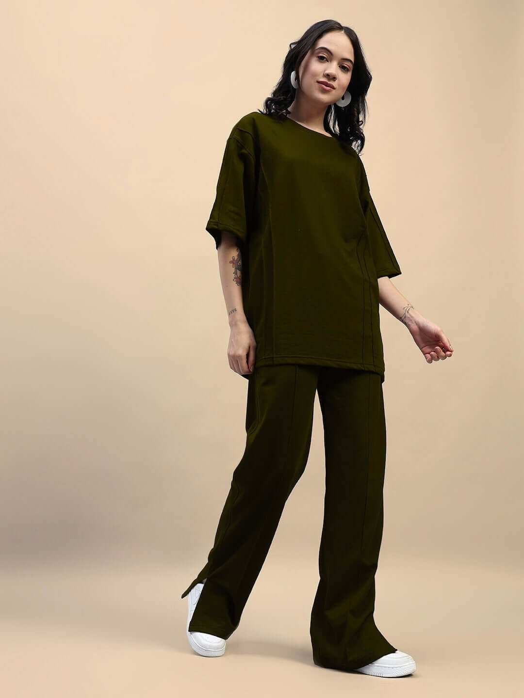 Women's olive green relaxed fit co-ord set with joggers and t-shirt, made from cotton and elastane, featuring an elastic waistband.