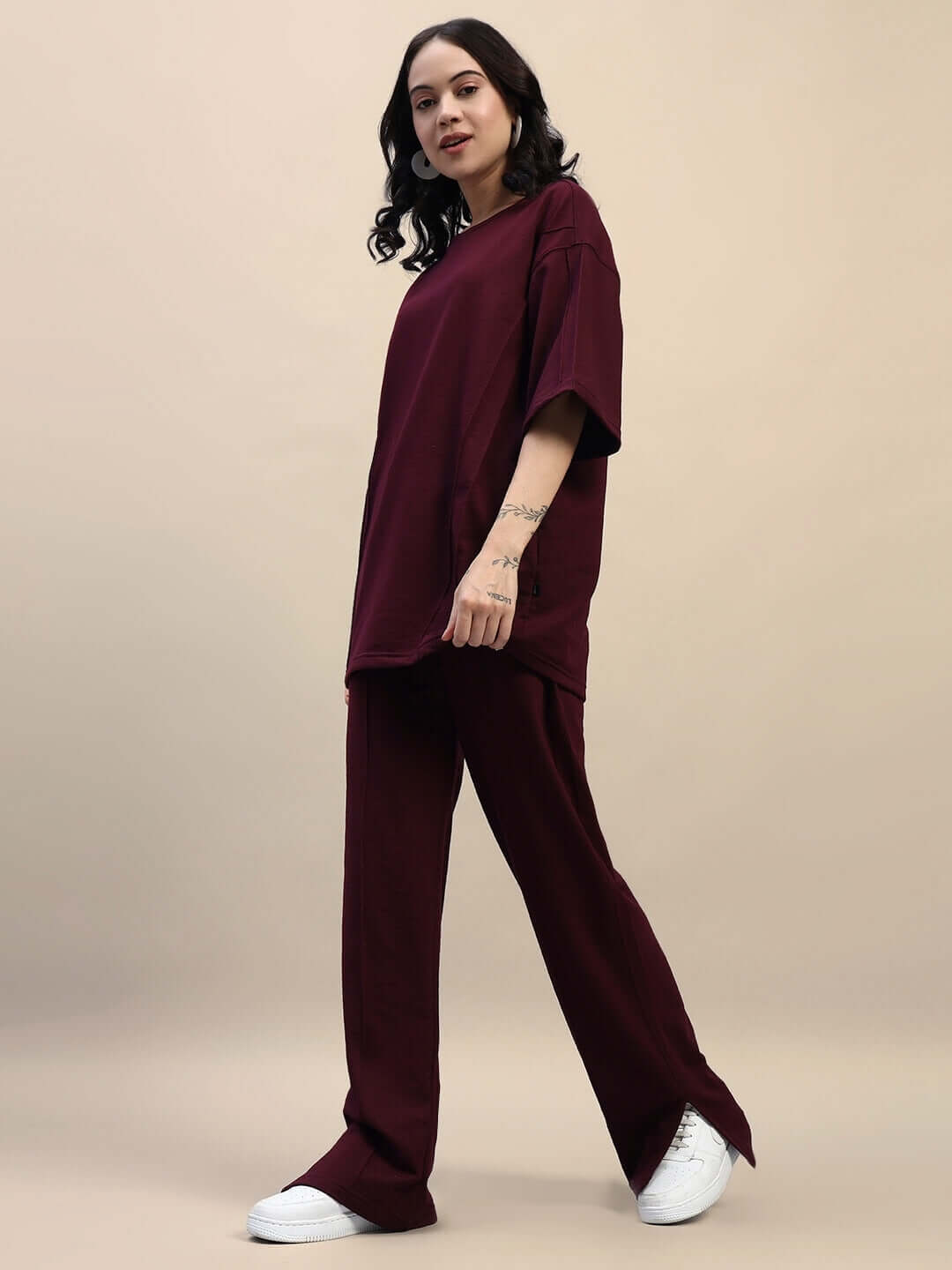 Woman wearing WOMEN'S ZION RELAXED FIT CO-ORD SET MAROON, showcasing comfortable and stylish maroon outfit perfect for casual wear.