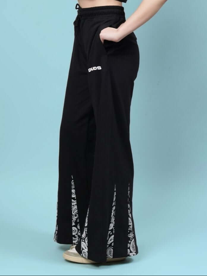 Alt Tag: Women's Ziya Baggy Joggers in black with detailed side slits, crafted by DUDS. Features customizable fit for a tailored look.