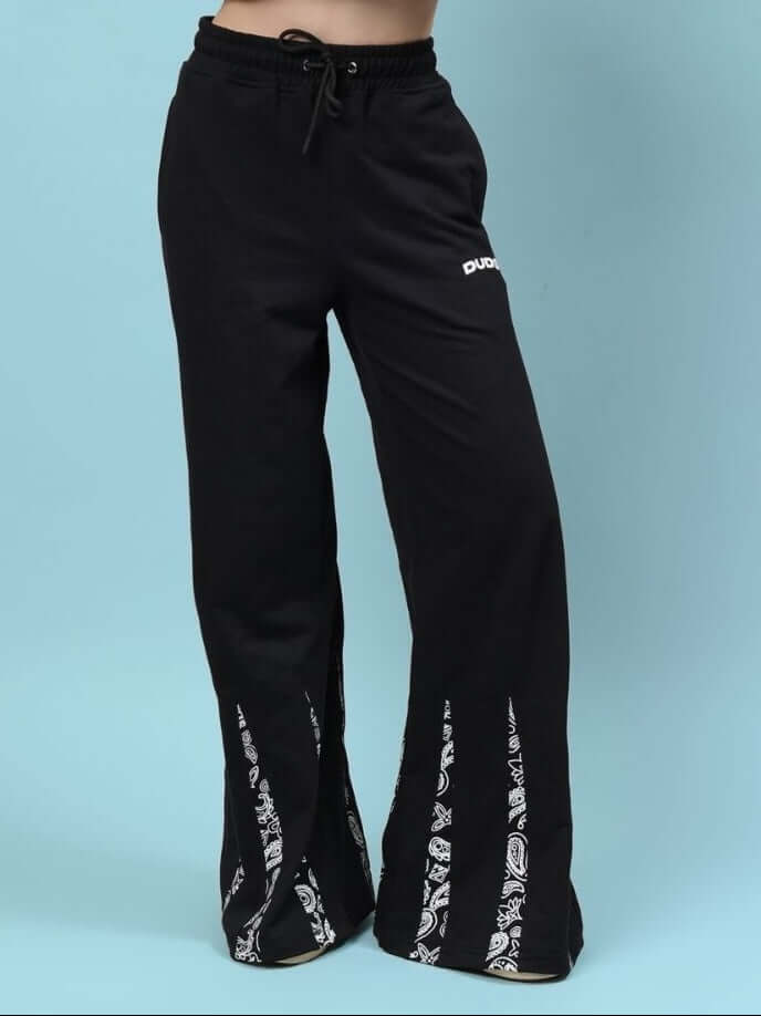 A close-up of the Women's Ziya Baggy Joggers in black, featuring a loose fit, drawstring waistband, and stylish pattern accents on the legs.