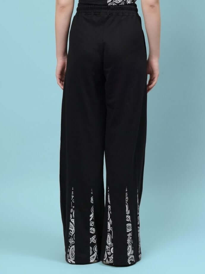 Back view of Women's Ziya Baggy Joggers in black, showcasing detailed design and custom fit option, crafted by DUDS tailors.